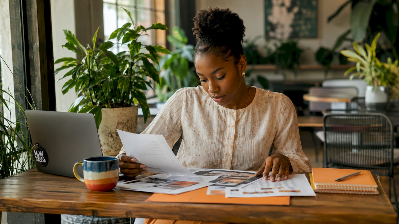 Marketing strategist reviewing campaign materials