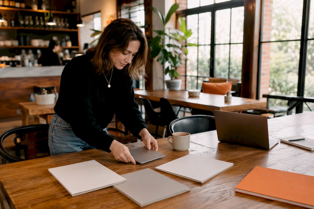 Hands arranging media for advertising campaign