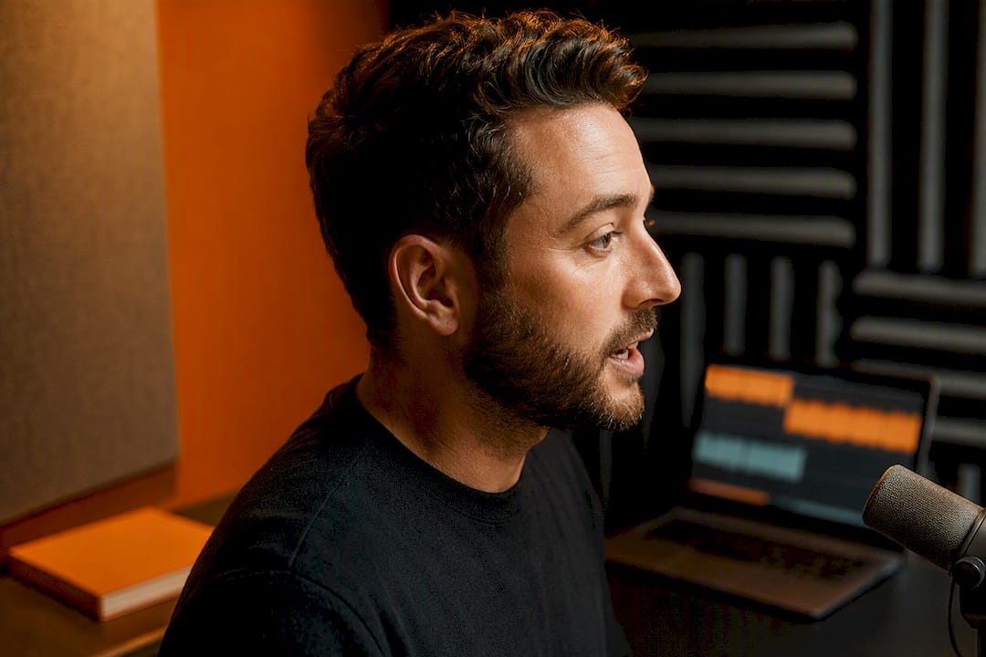 Host recording a local podcast advertisement